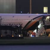 Passengers leaving a plane at Manchester Airport
