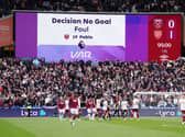 A big screen at the London Stadium shows the VAR decision to disallow West Ham's goal