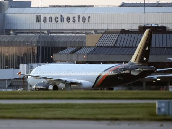 A plane at Manchester Airport carrying passengers that have been repatriated to the UK from cruise ship MV Hondius, which was hit by hantavirus