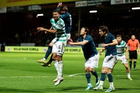 Motherwell's Sam Nicholson fouls Celtic's Auston Trusty (left) in the box resulting in a penalty being awarded