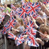Children wave Union flags