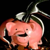 A piggy bank being smashed