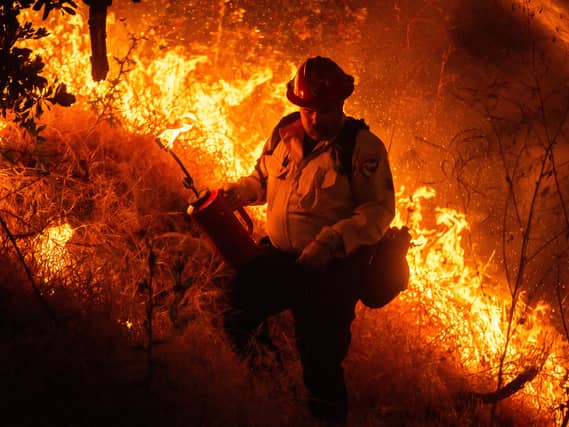 Photos show firefighters battling Southern California blaze