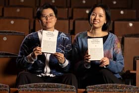Yang Shuang-zi and Lin King holding copies of Taiwan Travelogue