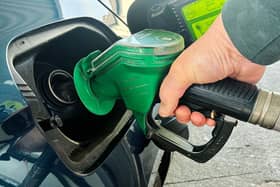 A person fills a car with petrol at a service station on the Dublin’s northside.