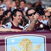 Unai Emery, Manager of Aston Villa, poses for a selfie on the bus during the Aston Villa trophy parade