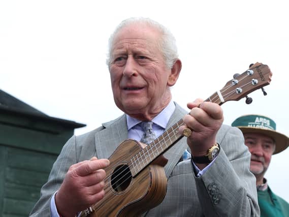 Charles playing a ukulele