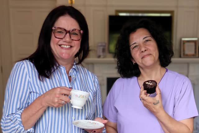 Sally Woods (left) with a colleague getting ready for Cuppa for Compton Week