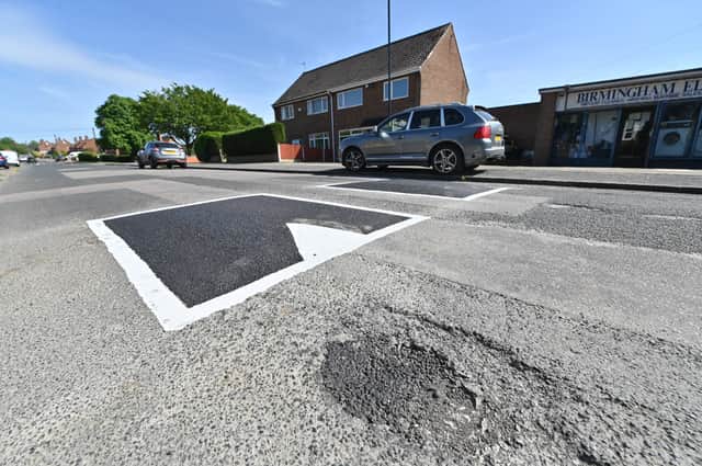 Booths Lane, Great Barr, where residents are dismayed that efforts have been made to put a load of tarmac on the road to build speed bumps, while leaving pot holes