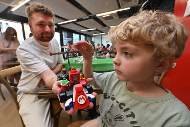 Visitors Rhys and Luke building Lego at Brick & Beyond