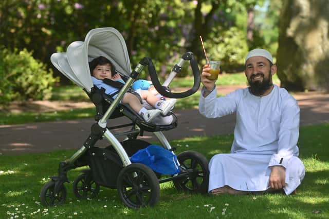Adil Rashed with eight month old Musa, could resist the nice weather