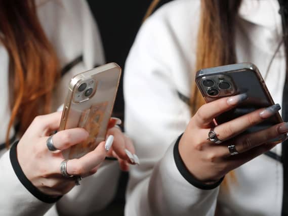 Female hands with smartphones