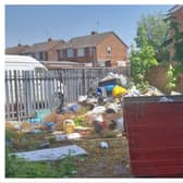 Huge amounts of rubbish has been piled up and left outside a closed down fish and chip shop in Wednesbury.