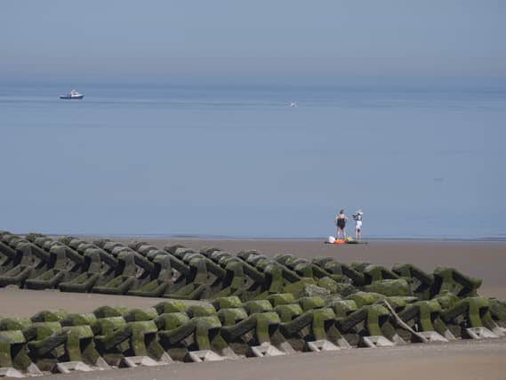 People enjoying the hot weather on New Brighton Beach on the Wirral