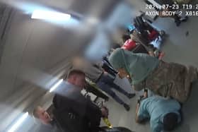A video grab from police bodyworn camera of footage of the alleged assault at Manchester Airport