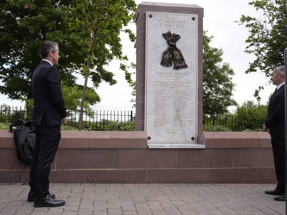 Liverpool chief executive Billy Hogan and Juventus' Peter Silverstone look at the new Heysel memorial at Anfield