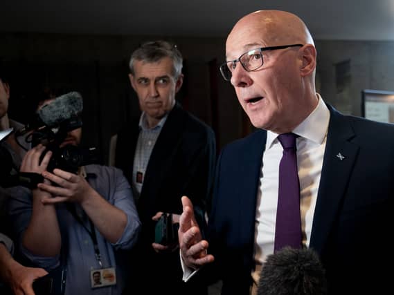 John Swinney speaking to the media