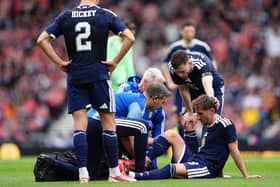Billy Gilmour receives treatment for an injury