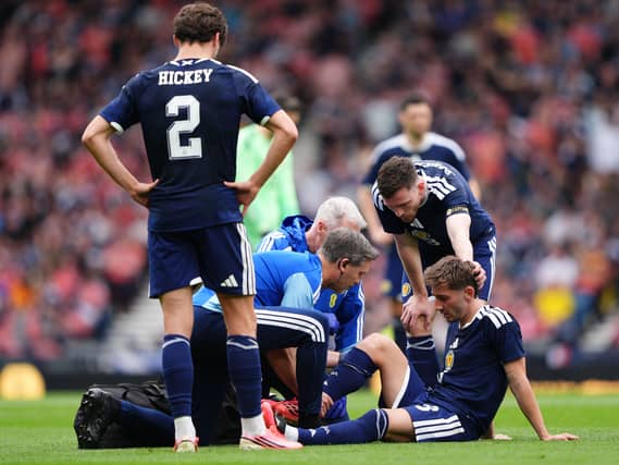 Billy Gilmour receives treatment for an injury