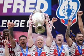 Wigan Warriors’ Liam Farrell lifts the Challenge Cup