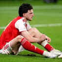 Declan Rice sits dejected on the pitch