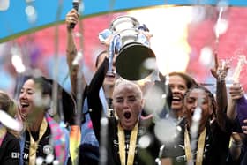 Alex Greenwood lifts the trophy