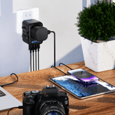 The compact travel adapter is designed to charge phones, tablets and gadgets across multiple countries from one device