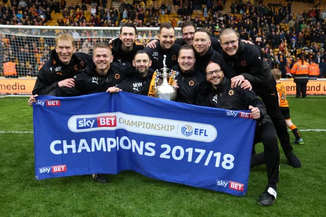 Andrew Findlay celebrating Wolves' Championship title with the Molineux backroom boys.