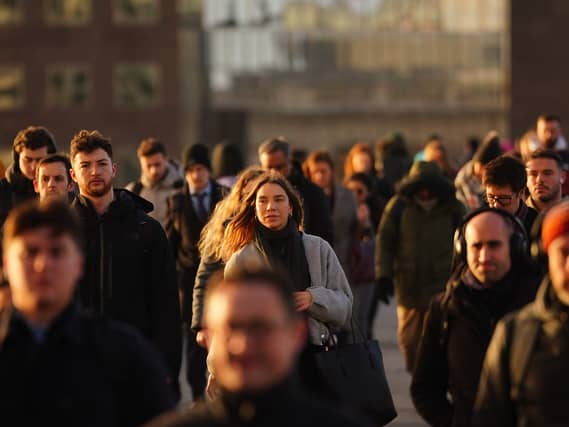 People walk through the centre of London