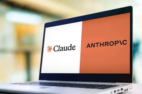 A laptop showing the Claude and anthropic logos