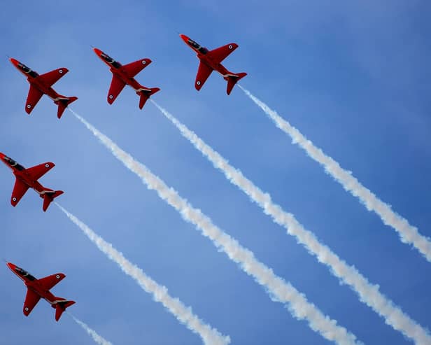 The Red Arrows go through one of their aerobatic displays at RAF Scampton on 12 November 12 2009.