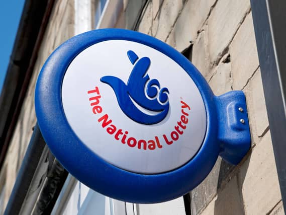 Close up of The National Lottery Lotto sign outside a shop