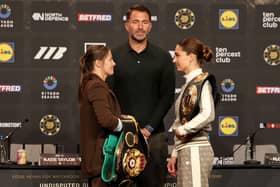 Katie Taylor, left, and Flora Pili face off in front of promoter Eddie Hearn during a press conference at Croke Park in Dublin