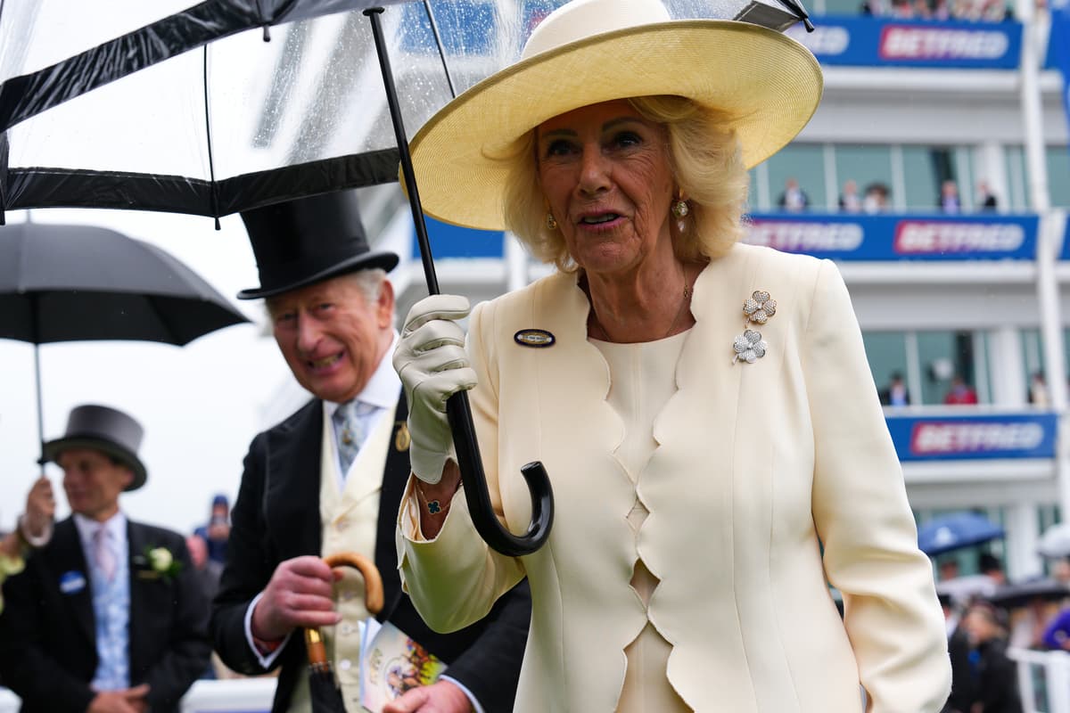 King and Queen defy downpours to revive royal tradition at Epsom Derby