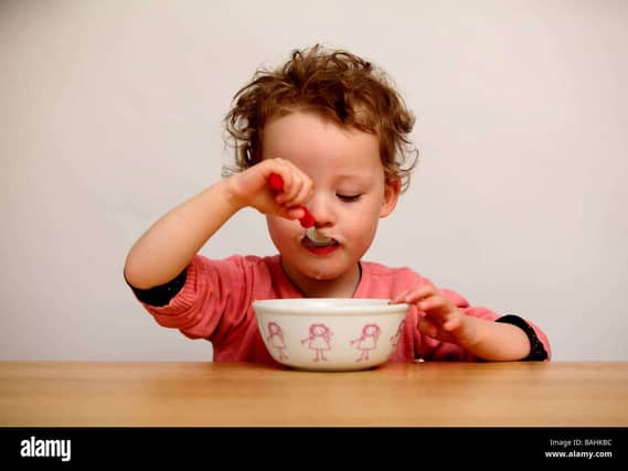 A child eating cereal.