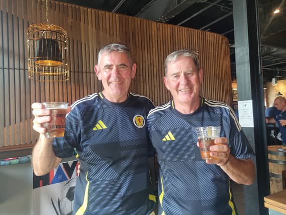 Brothers Peter (left) and Sean Reilly, who are in Boston for the World Cup