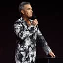 Robbie Williams presents the Best Song award during the 2026 Brit Awards