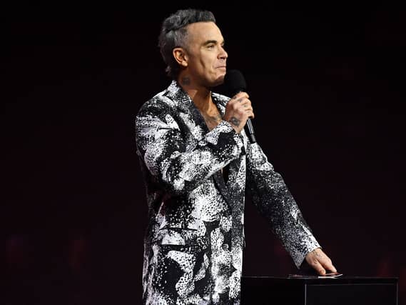 Robbie Williams presents the Best Song award during the 2026 Brit Awards