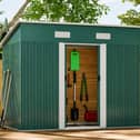 The galvanised steel shed includes lockable double doors, ventilation panels and an integrated floor