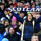 A Scotland fan with a scarf