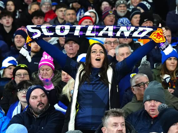 A Scotland fan with a scarf
