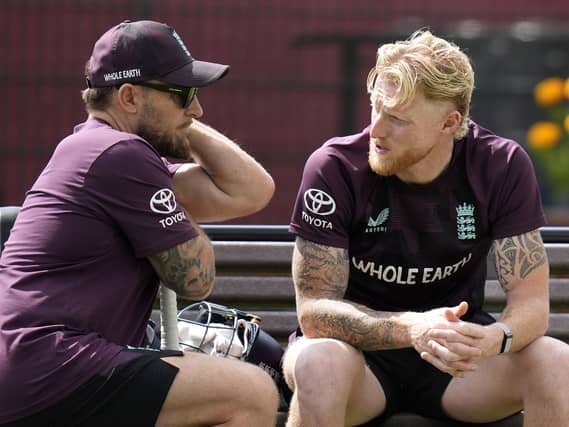 England head coach Brendon McCullum, left, and Ben Stokes talk during a net session