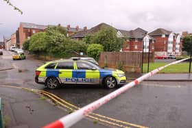 A police cordon at the scene of the stabbing outside apartments in the Kinnaird Avenue area of north Belfast