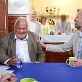 The Prince of Wales (right) speaks with Paul Gannon during a visit to Norfolk and Waveney Mind in Norwich