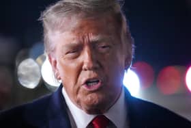 President Donald Trump talks with reporters before boarding Air Force One at John F. Kennedy International Airport in New York