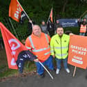 Glen Dimplex workers in Pensnett have agreed to retun to work while negotiations continue. Front row: In orange: Adrian Hill, union rep, Stuart Perry, GMB, in yellow, and union rep Adrian Malpass