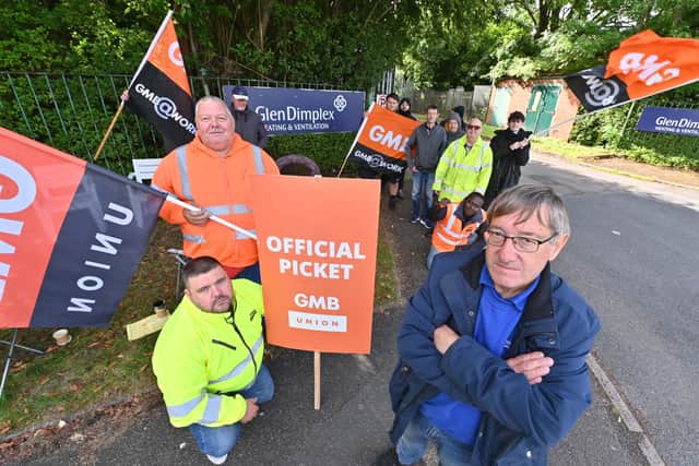 Glen Dimplex in Brierley Hill, and staff are on strike as owners impose new conditions including a 50 per cent increase in production. Front group: Adrian Hill (union rep in orange), Stuart Perry (GMB Midlands regional organiser in yellow), local rep Adrian Malpass (front right)