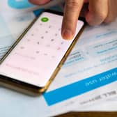 Person using a phone calculator
