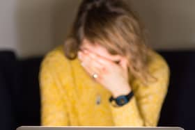 A woman looking stressed