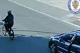 The man could be seen riding his bike as the car approaches on the video